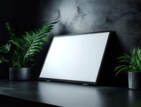 Laptop with blank white screen on dark desk surrounded by green potted plants against textured wall, modern workspace setup for web design and digital marketing mockups.