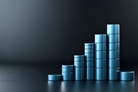 Metallic blue cylinders arranged in ascending and descending order creating growth chart shape on dark background, illustrating business progress concept.