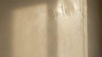 Translucent plastic wrap with light reflections and creases, suitable for packaging, product protection, and commercial material concepts.