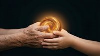 An older adult hand and younger hand touching with glowing golden energy orb between them, symbolizing wisdom transfer, mentorship, healing connection, and intergenerational support on dark background.