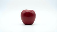 Fresh red apple isolated on white background, suitable for food packaging, nutrition labels, healthy eating campaigns, and culinary design projects.