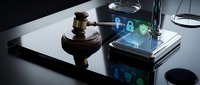 Digital security concept with wooden gavel and smartphone displaying cybersecurity icons on modern desk for legal technology and data protection themes.
