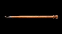 Wooden crochet hook with smooth finish and decorative knob end, isolated on transparent background. Ready for crafting tutorials, design projects, and print-on-demand products.