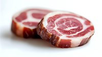 Raw pancetta slices with marbled fat pattern isolated on white background ready for cooking and culinary preparations.