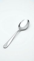 Single stainless steel tablespoon isolated on white background for kitchen utensil design and culinary branding projects.