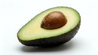 Fresh avocado half with pit isolated on white background, ready for food and nutrition design projects, cooking websites, and healthy eating content.