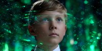 Young boy with bright blue eyes surrounded by glowing green digital particles and futuristic interface elements against dark background, representing AI and technology.