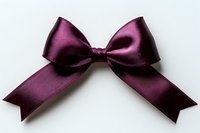 Elegant burgundy satin bow ribbon isolated on white background, featuring symmetrical loops and tails with clean edges, suitable for gift wrapping and craft projects.