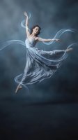 Graceful young woman dancer leaping through air with flowing silver dress and ethereal light trails against dramatic smoky background for artistic projects.