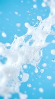 Clear water splash with droplets against bright blue sky background for refreshing summer beverage and hydration concepts.
