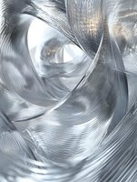 Abstract metallic silver waves and curves creating dynamic flowing motion with light reflections and smooth glossy texture on white background.