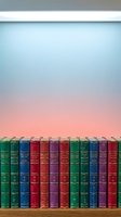 Colorful antique leather-bound books arranged on wooden shelf against soft gradient pastel background, featuring green, blue, red, and purple spines with gold lettering and decorative elements for library and interior design projects.