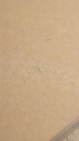 Smooth golden sand texture with fine grains and natural patterns for beach vacation backgrounds and summer design projects.