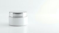 White cosmetic jar with silver lid on clean background for skincare product packaging and beauty brand marketing materials.