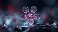 Crystal flower ornament with pink lighting on dark background creates elegant decorative atmosphere for luxury jewelry and gift concepts.