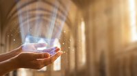 Hands holding glowing digital globe with light rays, representing global connectivity, technology innovation, and worldwide business communication in modern digital world.