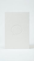 Embossed speech bubble on cream textured paper card, minimalist communication design for greeting cards, invitations, and stationery projects.