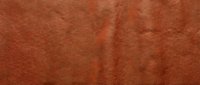 Terracotta leather texture with natural creases and worn surface, suitable for backgrounds, design projects, and material mockups.