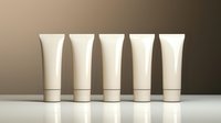 Five beige cosmetic tubes arranged in row on white surface against neutral background for skincare product mockup and branding presentation.