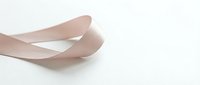 Elegant female hands with natural manicure in soft gesture against clean white background for beauty and skincare concepts.