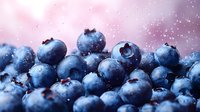 Fresh ripe blueberries with water drops in soft pink light, macro food photography with shallow depth of field and bokeh effect for healthy eating concept.
