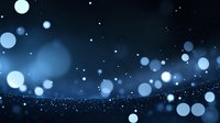 Dreamy blue bokeh lights floating in dark space with glowing particles and blurred circles creating magical atmospheric effect. Night sky background.