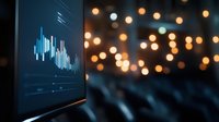 Financial market data visualization on digital screen with blurred bokeh lights background creating modern business atmosphere.
