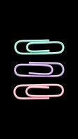 Three pastel paper clips in mint, lavender, and pink isolated on transparent background, ready for stickers, clipart, t-shirt design, and print on demand use.
