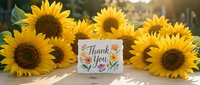 Bright sunflowers surround a floral thank you card on a wooden table in warm sunlight, perfect for gratitude and celebration concepts.