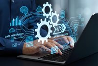 Business professional using laptop with digital automation technology interface displaying gears, data analytics and API integration icons for workflow optimization.