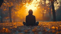 Silhouette of person sitting on autumn forest floor at sunset, surrounded by golden fallen leaves in peaceful meditation pose.