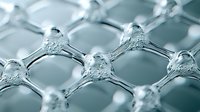 Molecular structure in hexagonal pattern showing crystalline lattice formation with interconnected nodes and bonds, macro view in cool blue tones.