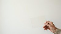Mature adult hand with wrinkled skin gesturing against neutral background, suitable for healthcare, aging, senior lifestyle, and wellness editorial content.
