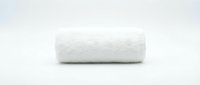 Rolled white towel isolated on clean background, ready for spa, hotel, bathroom, and wellness design projects.