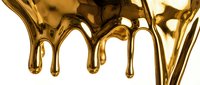 Liquid gold dripping and flowing downward against white background, creating glossy metallic streams with reflective surfaces for luxury design projects.