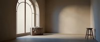 Minimalist interior with arched window casting warm light, vintage suitcase and wooden stool on polished floor, empty room for design projects.