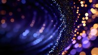 Glowing dots forming curved lines with blurred bokeh lights in dark blue and orange colors create mesmerizing abstract background pattern for technology designs.