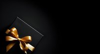 Black gift box with golden ribbon bow on dark background, luxury present for holidays, celebrations, and special occasions.