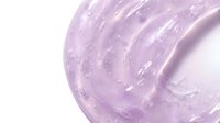 Purple hair gel with glossy texture and smooth swirls isolated on white background for beauty and styling product advertisements.