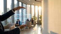 Business professional hands framing modern office space with floor-to-ceiling windows and city view for real estate investment planning.