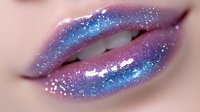 Macro shot of glossy lips with cosmic galaxy-inspired makeup featuring pink and blue glitter, sparkles, and holographic effects creating ethereal artistic beauty makeup look.