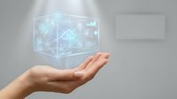 Cloud computing technology hologram floating above open hand, representing digital infrastructure, data storage, and network connectivity for business solutions.