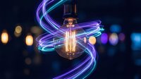 Vintage Edison bulb with glowing filament surrounded by dynamic purple and blue light trails against blurred city lights background for creative energy concepts.