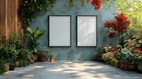 Empty black frames on turquoise wall in garden patio with potted plants, red flowers and natural sunlight casting shadows. For interior design and home decor.