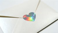 Holographic heart sticker on white envelope with string, perfect for gift wrapping, greeting cards, invitations, and festive packaging designs.