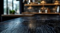 Empty dark wooden table surface with blurred restaurant kitchen background, warm lighting and bokeh effects for food presentation and culinary display.