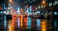Blurred city street at night with colorful neon lights reflecting on wet pavement, creating bokeh effect with traffic and urban atmosphere.
