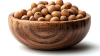 Fresh macadamia nuts in rustic wooden bowl on white background, raw organic healthy snack for natural food and cooking concept. Isolated with soft shadow.