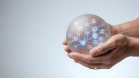 Hands holding glowing sphere with interconnected blockchain network nodes and digital icons, representing technology, data connection, and innovation for business solutions.
