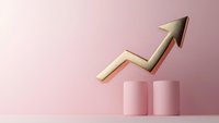 Golden arrow chart rising over pink cylinders on pastel pink background, symbolizing business growth and financial success in feminine market.
